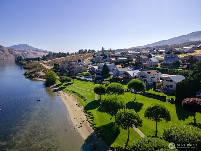 aerial view featuring a residential view and a water and mountain view