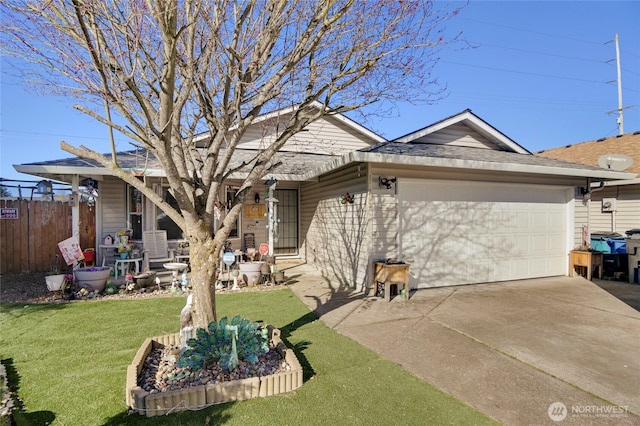 exterior space featuring an attached garage, fence, concrete driveway, and a front yard