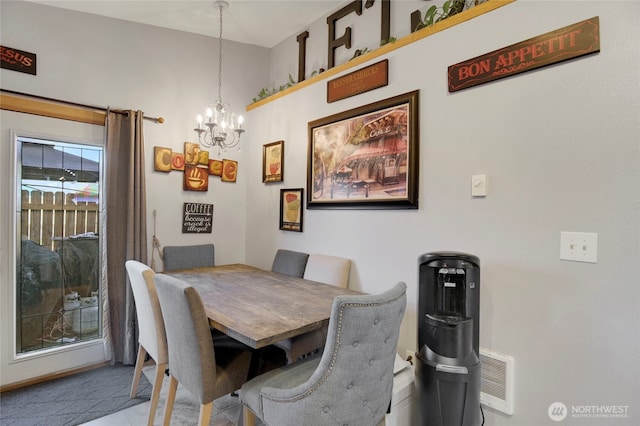 dining space featuring a chandelier