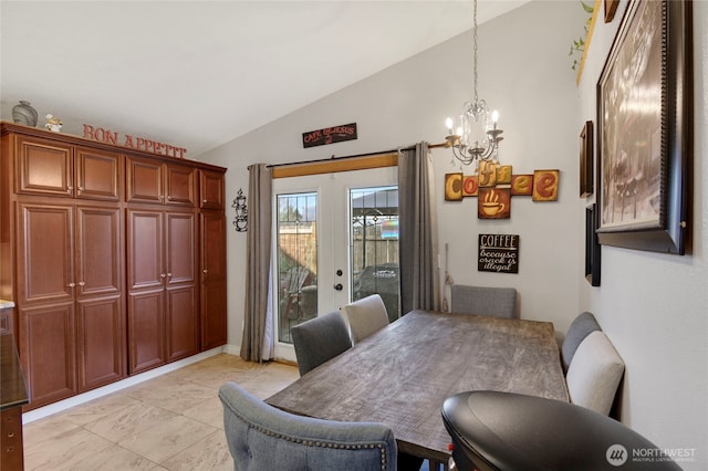 dining area with lofted ceiling, french doors, and a notable chandelier