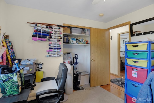 office space with ceiling fan and wood finished floors