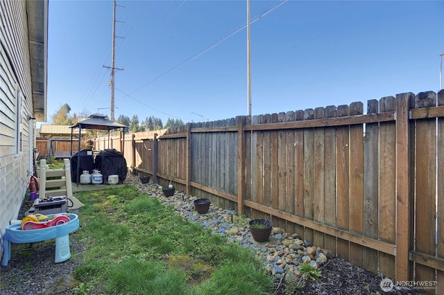 view of yard with a fenced backyard