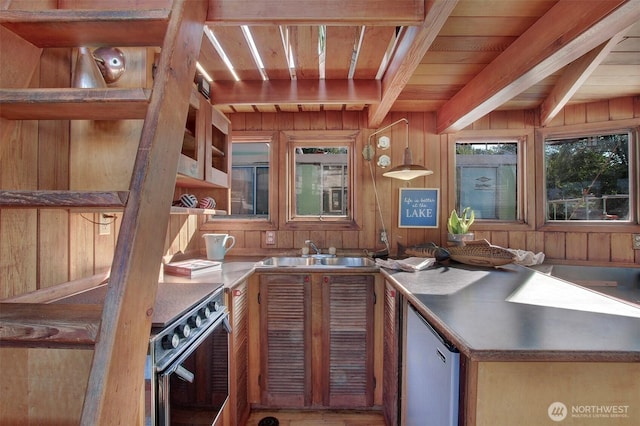 kitchen featuring wooden ceiling, wood walls, stove, a sink, and beam ceiling