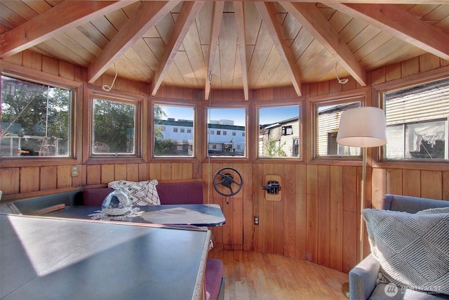 sunroom with wooden ceiling and beamed ceiling