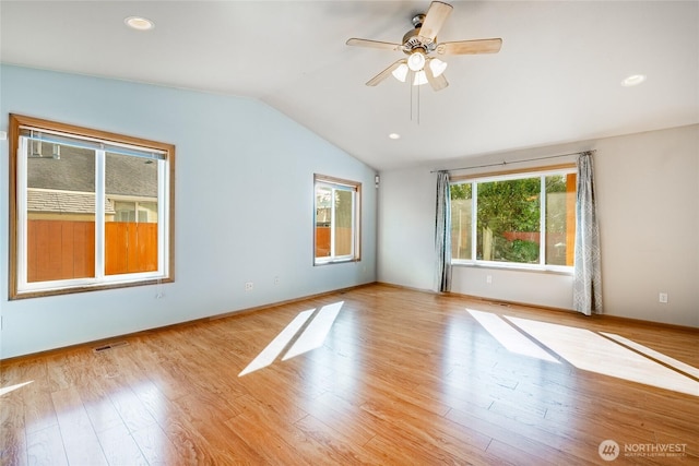 empty room featuring visible vents, ceiling fan, vaulted ceiling, recessed lighting, and light wood-style flooring