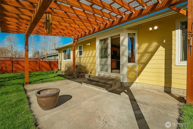 view of patio with fence and a pergola