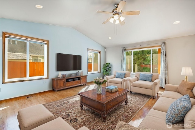 living room featuring visible vents, light wood finished floors, lofted ceiling, recessed lighting, and ceiling fan