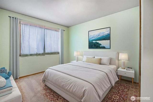 carpeted bedroom featuring baseboards