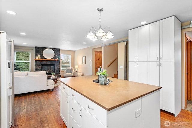 kitchen featuring recessed lighting, white cabinetry, and light wood finished floors