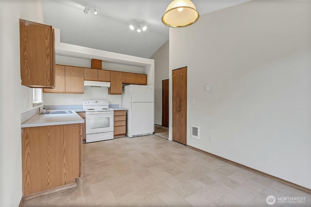 kitchen featuring light countertops, visible vents, a sink, white appliances, and under cabinet range hood