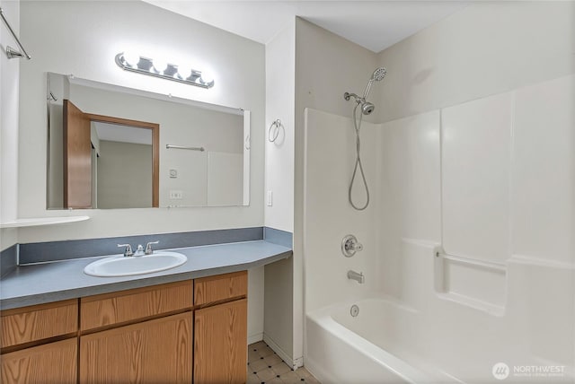 full bathroom featuring  shower combination, vanity, and tile patterned floors