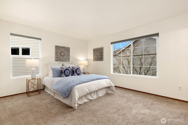 bedroom with carpet floors and baseboards