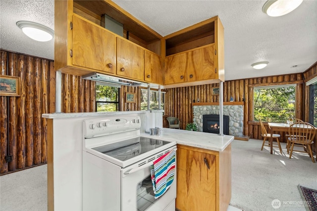 kitchen with wooden walls, white electric stove, light colored carpet, a textured ceiling, and under cabinet range hood