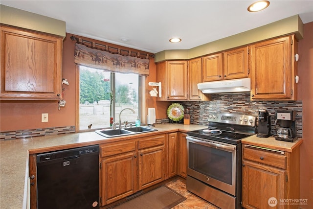 kitchen with under cabinet range hood, a sink, black dishwasher, light countertops, and stainless steel electric stove