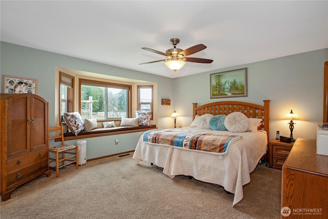 bedroom featuring baseboards, ceiling fan, visible vents, and carpet flooring