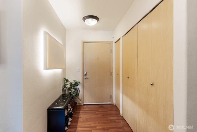 hall with wood finished floors