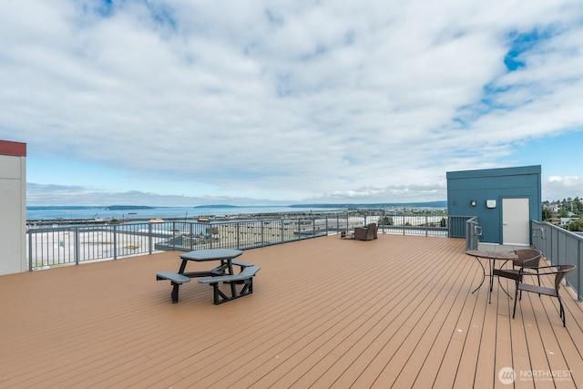 wooden terrace with a water view