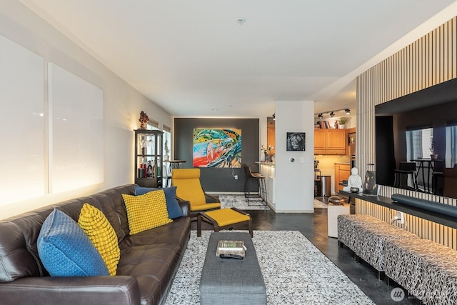 living room with plenty of natural light and finished concrete flooring