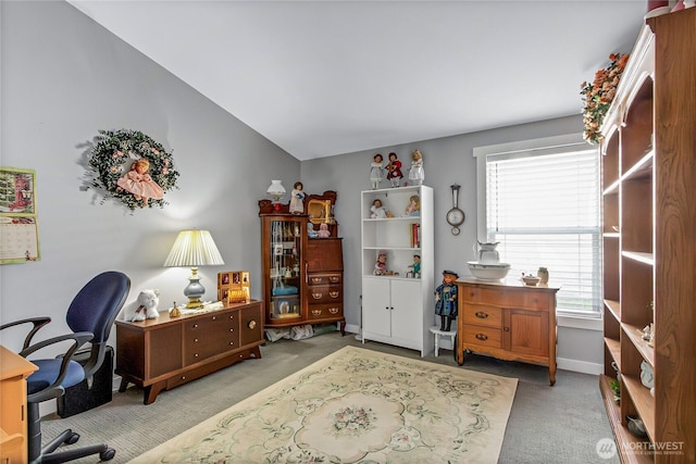 office space with vaulted ceiling, carpet flooring, and baseboards