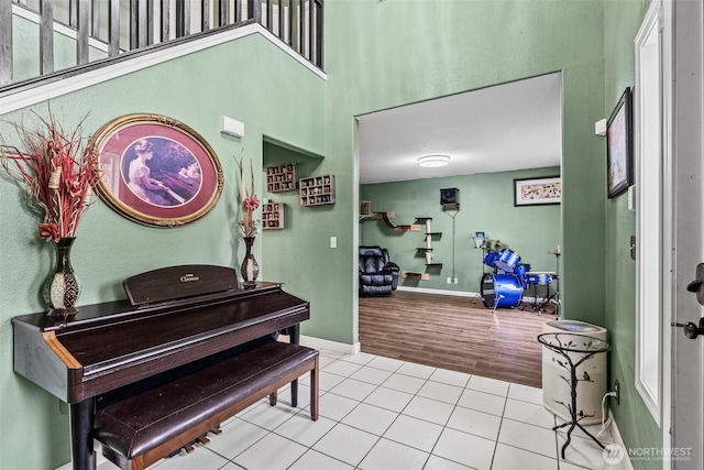 tiled foyer with baseboards