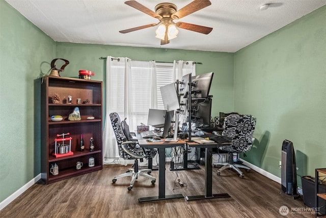 office space with ceiling fan, baseboards, and wood finished floors