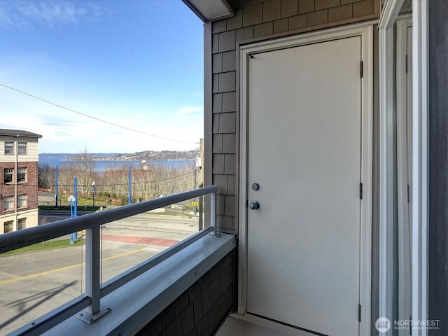 balcony featuring a water view