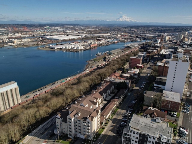 birds eye view of property featuring a water view and a city view