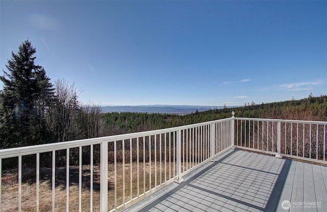 deck featuring a wooded view