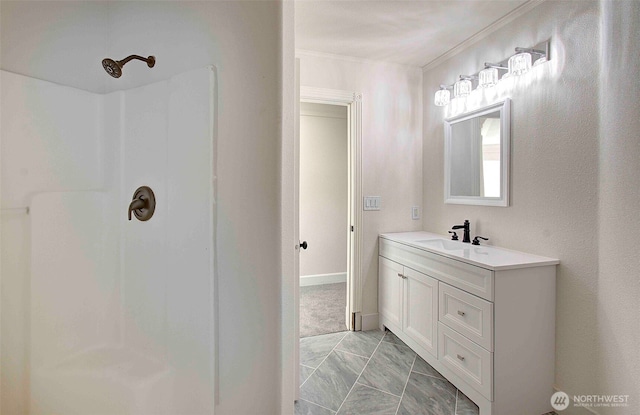 bathroom with a shower and vanity