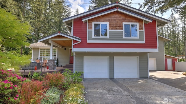 view of front of property with driveway and an attached garage