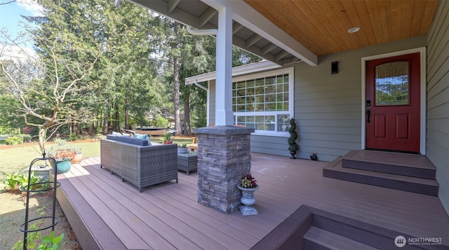 wooden deck featuring outdoor lounge area