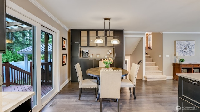 dining space with stairs, dark wood-style flooring, baseboards, and crown molding