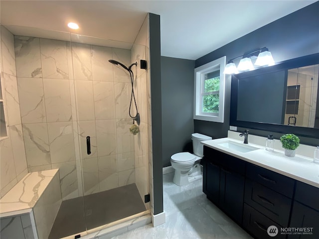 full bath with toilet, marble finish floor, a shower stall, and vanity