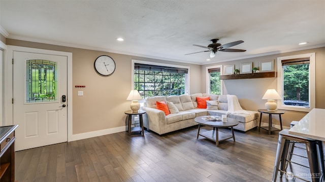 living area with recessed lighting, a ceiling fan, baseboards, ornamental molding, and dark wood finished floors