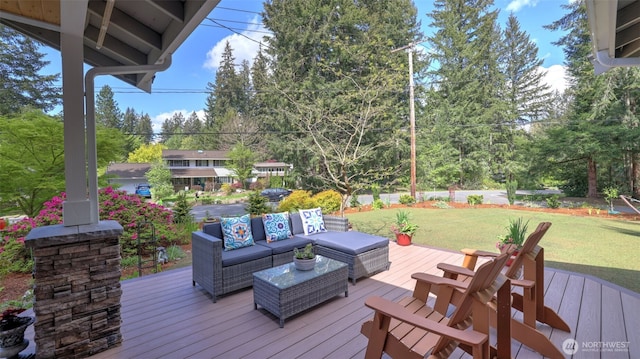 wooden deck with outdoor lounge area and a lawn