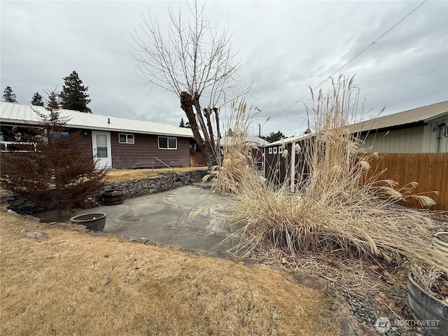 view of yard featuring a patio and fence