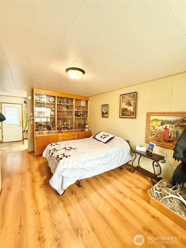 bedroom with wood finished floors