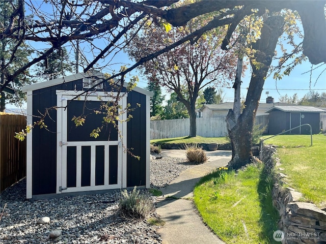view of shed with fence