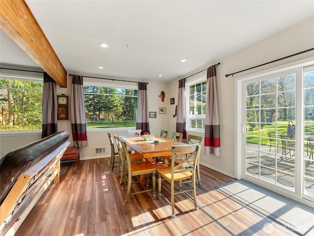 dining room featuring beam ceiling, wood finished floors, visible vents, and recessed lighting