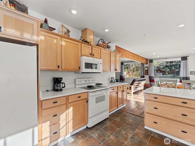 kitchen featuring white appliances, stone finish flooring, light countertops, light brown cabinetry, and recessed lighting