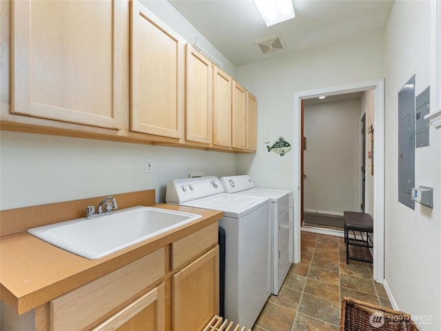 washroom featuring cabinet space, electric panel, visible vents, separate washer and dryer, and a sink