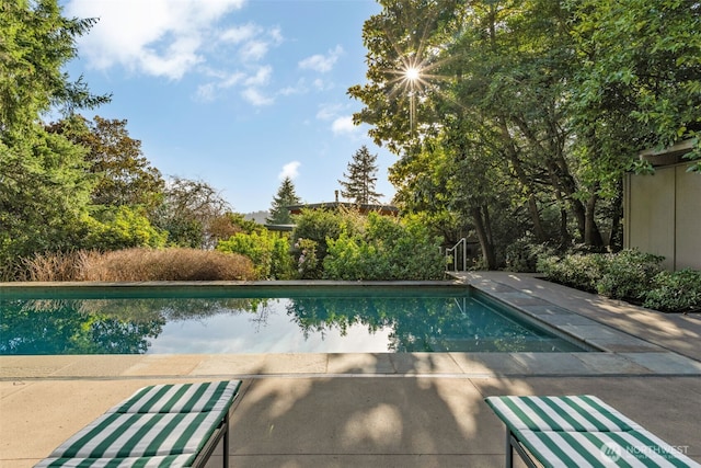 outdoor pool featuring a patio