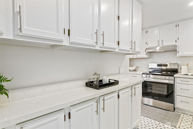 kitchen featuring under cabinet range hood, stainless steel electric range, white cabinetry, and light stone counters