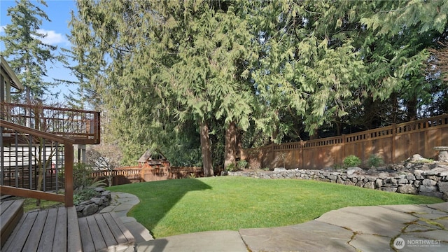 view of yard featuring stairway, a deck, and fence