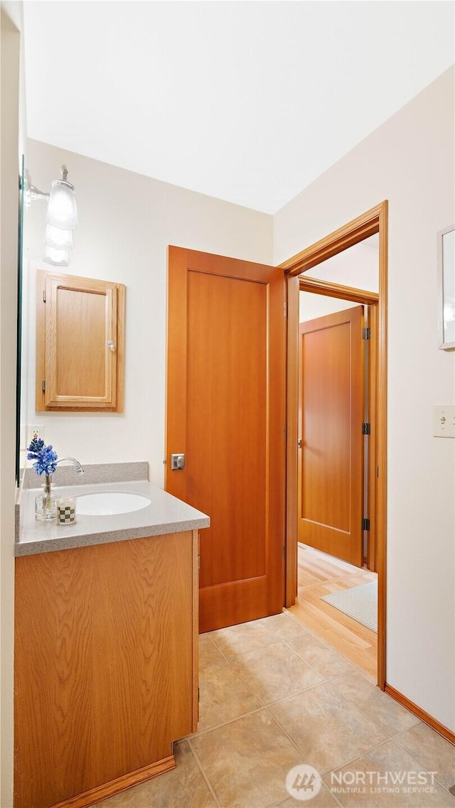 bathroom featuring vanity and tile patterned flooring