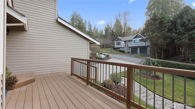 wooden terrace with a garage