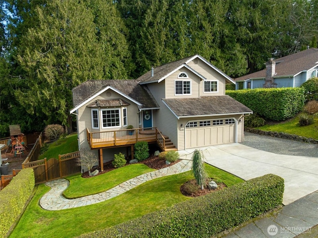 view of front of home featuring a front yard, fence, an attached garage, concrete driveway, and a playground