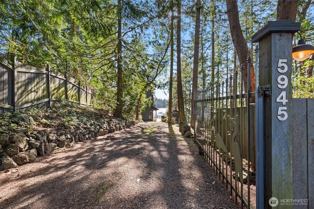 view of gate with fence