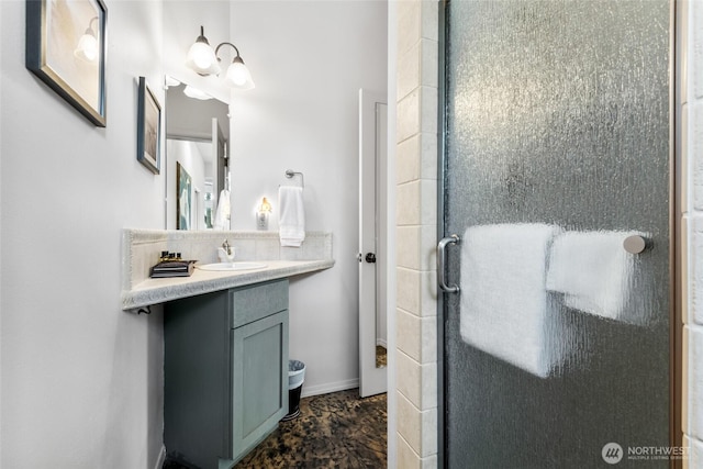 full bathroom featuring a shower stall and vanity