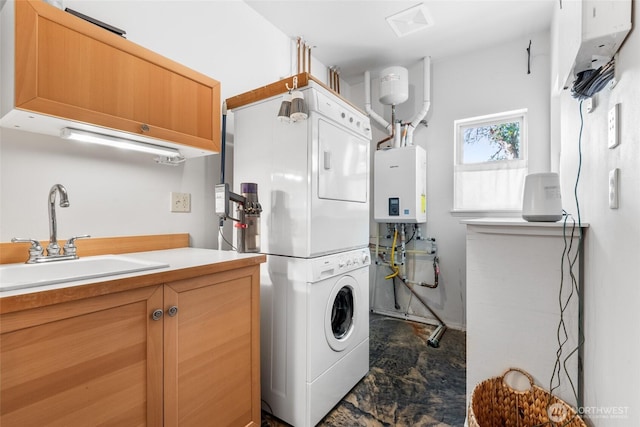 laundry room featuring cabinet space, water heater, stacked washer / dryer, tankless water heater, and a sink